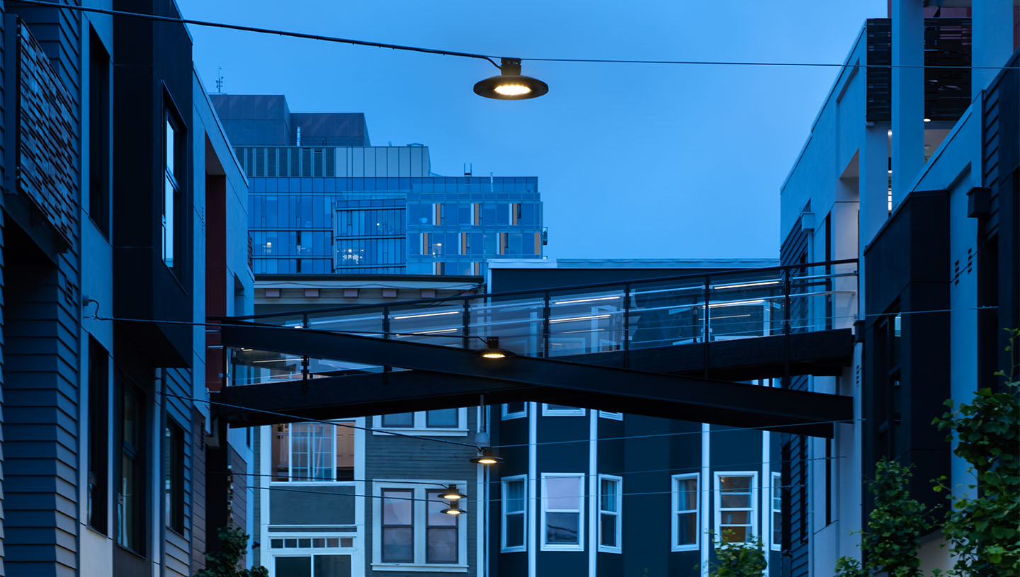 Close up of Maya luminaires suspended above street